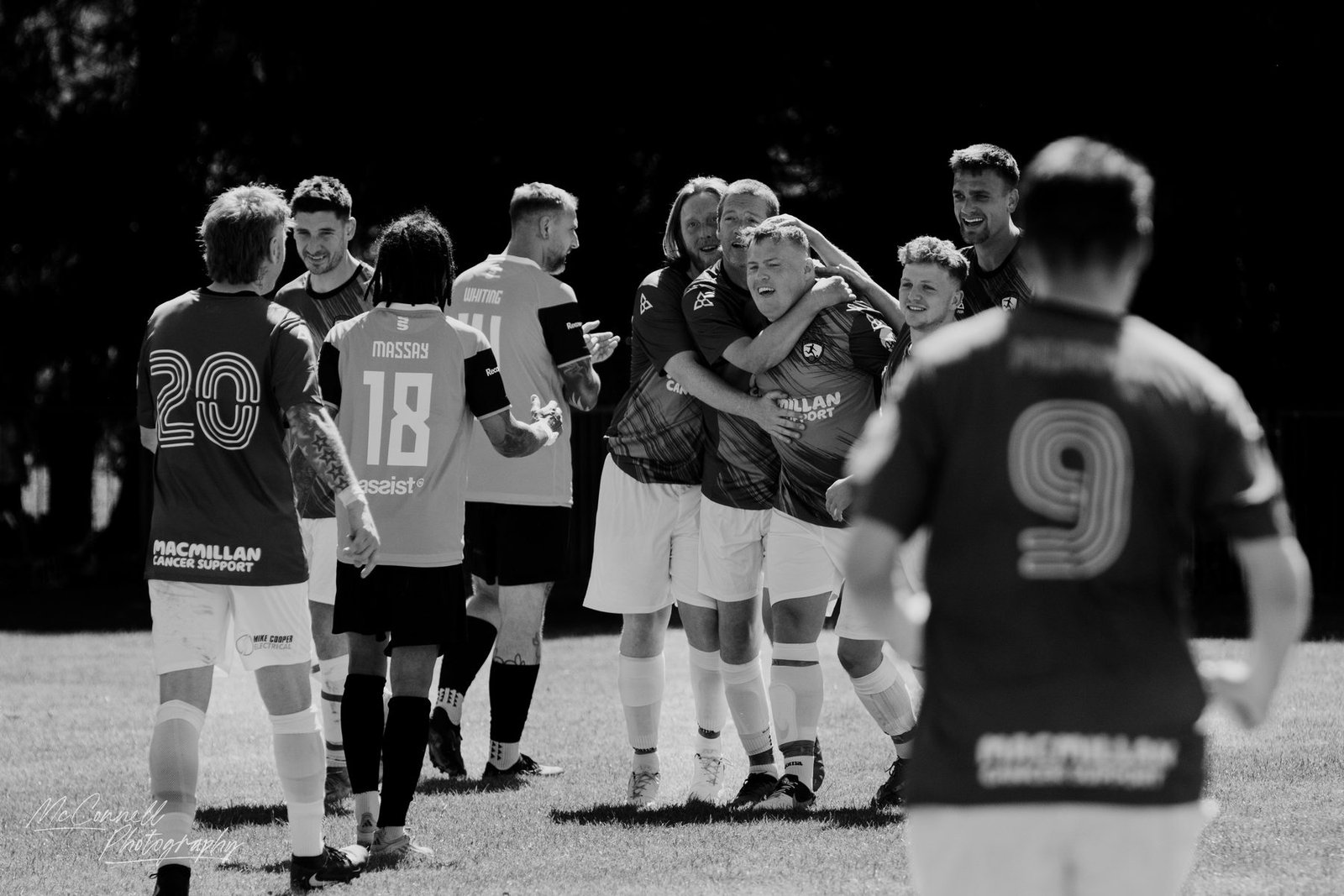 Team-mates piling in to celebrate a late goal