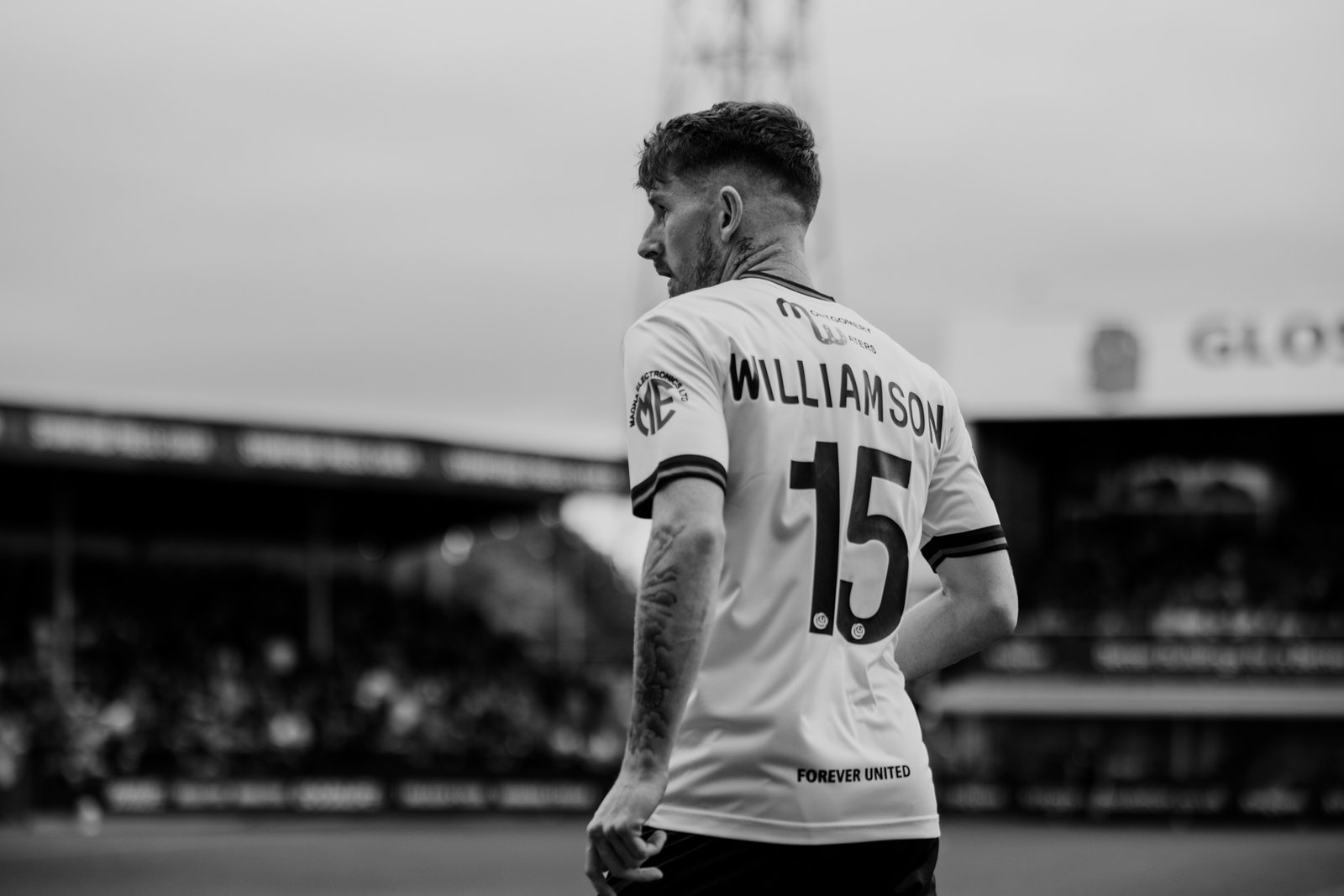 Black and white portrait of Williamson in a Hereford FC shirt