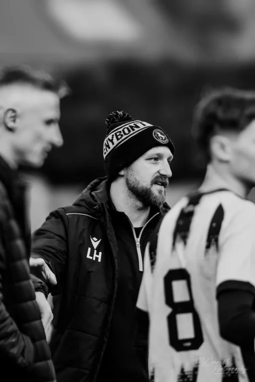 Portrait of a coach watching from the technical area